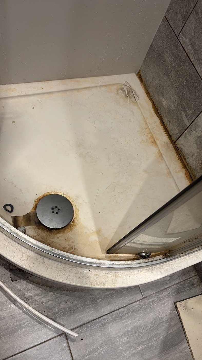 Dirty shower tray before cleaning